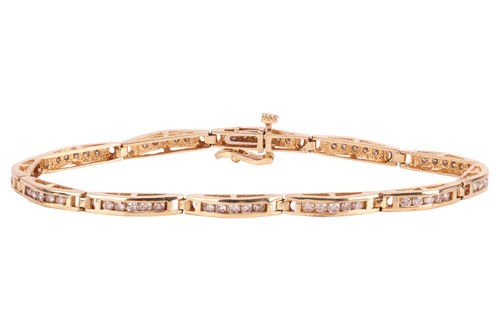 Lot 79 - A diamond-set line bracelet, with an estimated...