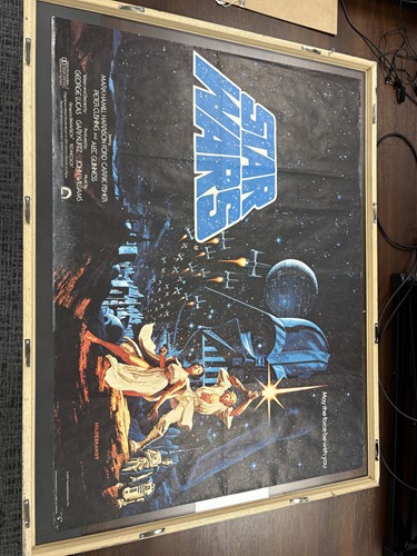 Lot 137 - A rare 1977 Star Wars British quad poster, the...