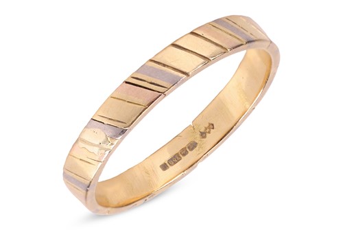 Lot 259 - A wedding band in 18ct tri-coloured gold, the...