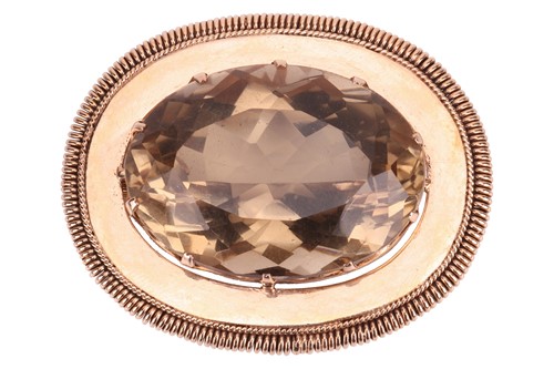 Lot 79 - A large smoky quartz pendant cum brooch,...