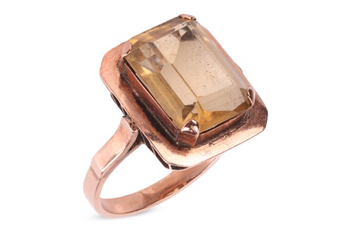 Lot 72 - A citrine dress ring, centred with an...
