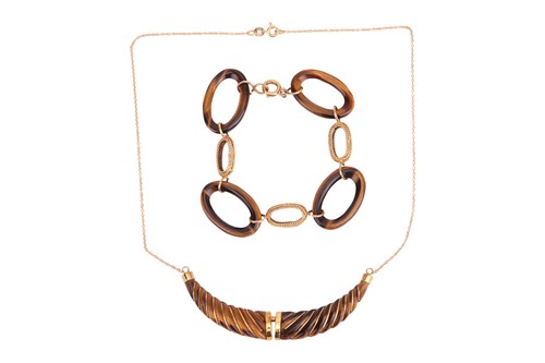 Lot 84 - A tiger's eye necklace and a bracelet; the...