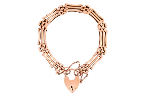 Lot 291 - A gate-link bracelet, comprising three-row...