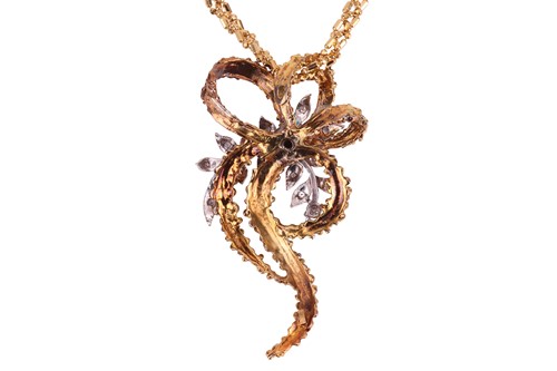 Lot 66 - A Modernist diamond-set floral pendant on...