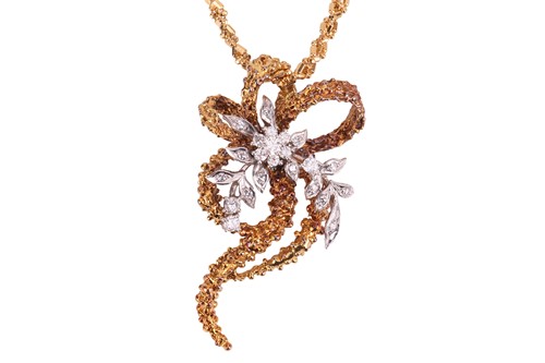 Lot 66 - A Modernist diamond-set floral pendant on...