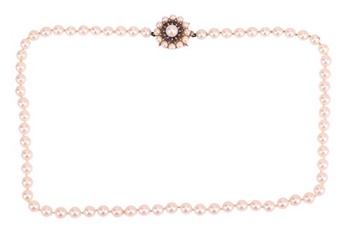 Lot 196 - A cultured pearl necklace with gem-set clasp...