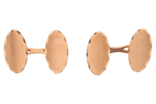 Lot 147 - A pair of oval cufflinks, each concave panel...