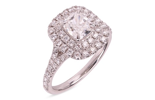 Lot 183 - A diamond cluster ring, featuring a central...