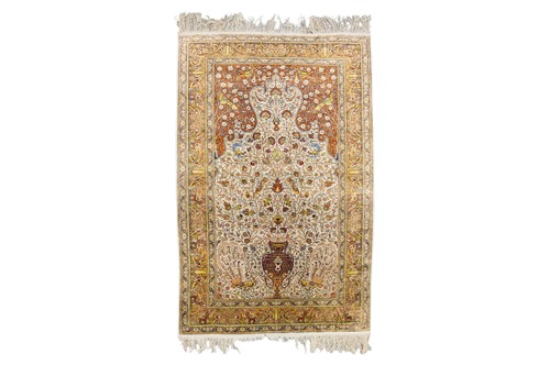Lot 99 - A Qum silk prayer rug, with peacocks, birds,...