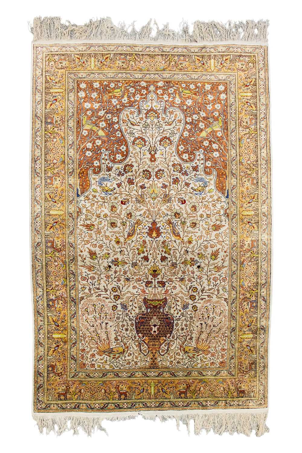 Lot 99 - A Qum silk prayer rug, with peacocks, birds,...