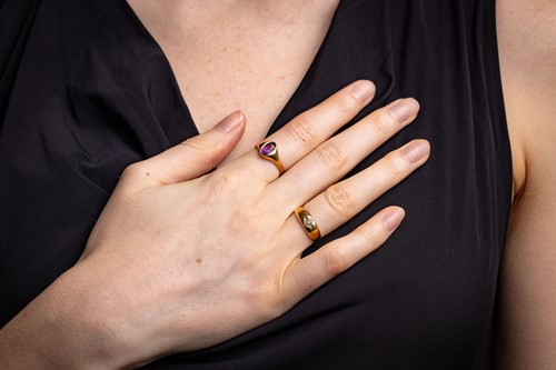 Lot 15 - Two gem-set gypsy rings in 18ct gold; the...