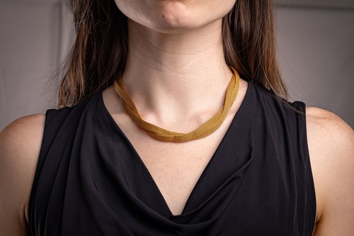 Lot 81 - A mesh link necklace, of loosely twisted...