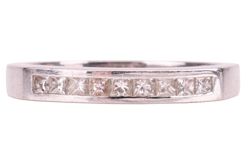 Lot 92 - A diamond half-eternity ring, featuring nine...