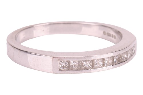 Lot 92 - A diamond half-eternity ring, featuring nine...