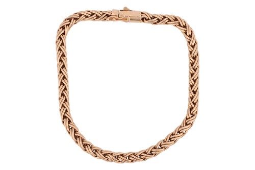 Lot 59 - Tiffany & Co. - A braided bracelet, of woven...