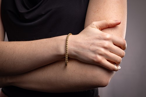 Lot 59 - Tiffany & Co. - A braided bracelet, of woven...