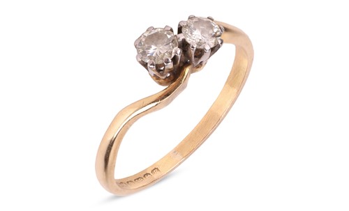 Lot 77 - A diamond-set Toi et Moi ring, featuring two...