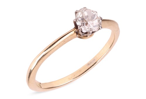 Lot 13 - A diamond solitaire ring, featuring a central...