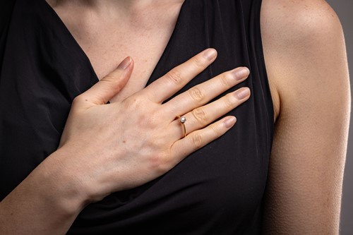 Lot 13 - A diamond solitaire ring, featuring a central...