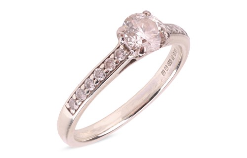 Lot 118 - A diamond solitaire ring, featuring a central...