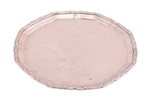 Lot 240 - An Edwardian circular silver waiter with a...