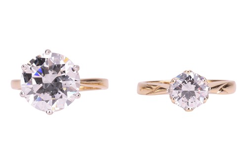 Lot 35 - Two CZ-set rings, the first featuring a CZ...
