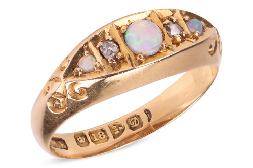 Lot 26 - An Edwardian opal and diamond-set half hoop...