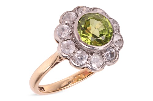 Lot 44 - A peridot-set floral cluster ring, composed of...