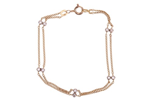 Lot 165 - A diamond-set bracelet in 18ct gold, featuring...