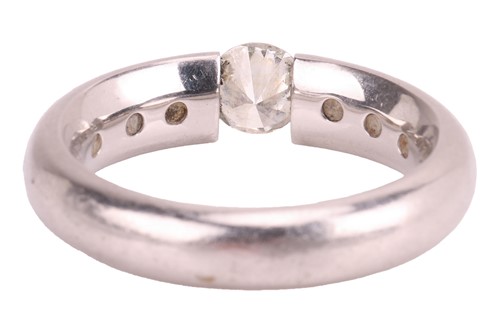 Lot 93 - A tension-set diamond solitaire ring, centred...