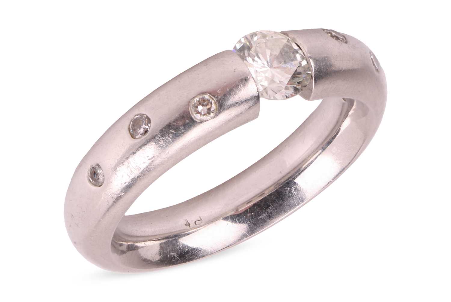 Lot 93 - A tension-set diamond solitaire ring, centred...