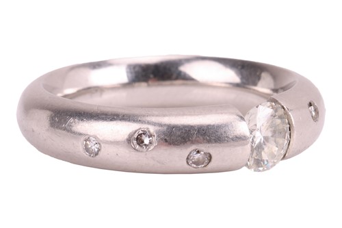 Lot 93 - A tension-set diamond solitaire ring, centred...