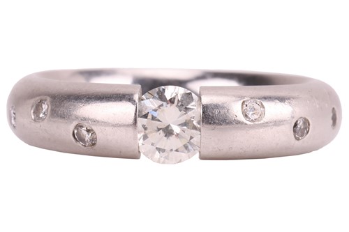 Lot 93 - A tension-set diamond solitaire ring, centred...