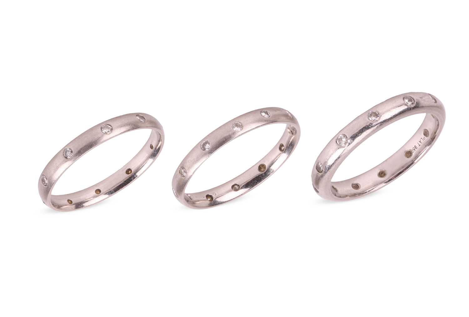 Lot 95 - Three diamond-set eternity bands, the first...