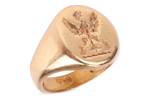 Lot 126 - An 18ct gold signet ring, the oval head with...
