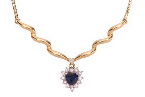 Lot 149 - A diamond and sapphire cluster pendant...