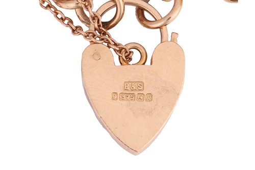 Lot 125 - A 9ct gold charm bracelet, composed of a curb...