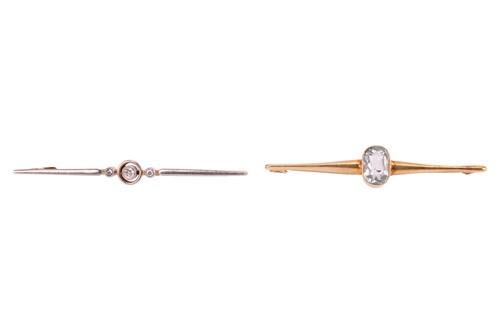 Lot 31 - Two bar brooches; the first bezel-set with an...