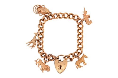 Lot 110 - A charm bracelet, comprising a series of metal...