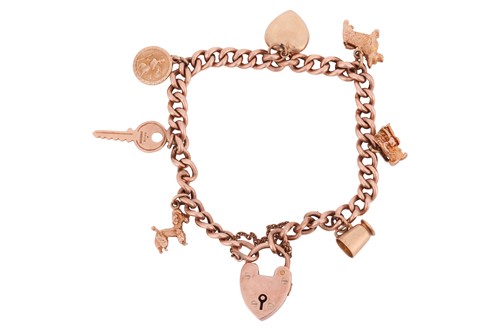 Lot 87 - A charm bracelet, composed of a flat curb link...