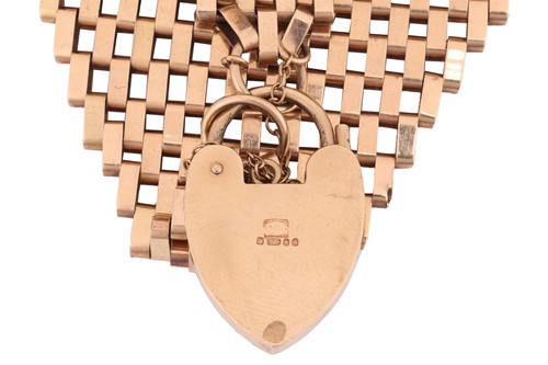 Lot 75 - A wide gate link bracelet in 9ct gold,...