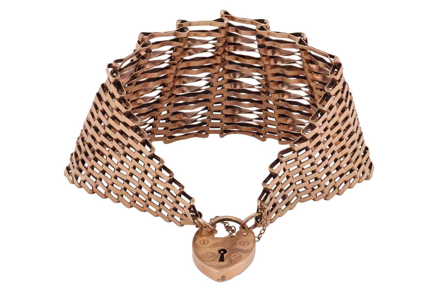 Lot 75 - A wide gate link bracelet in 9ct gold,...