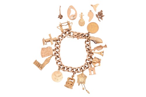 Lot 157 - A charm bracelet, composed of a 9ct yellow...