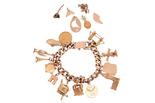 Lot 157 - A charm bracelet, composed of a 9ct yellow...