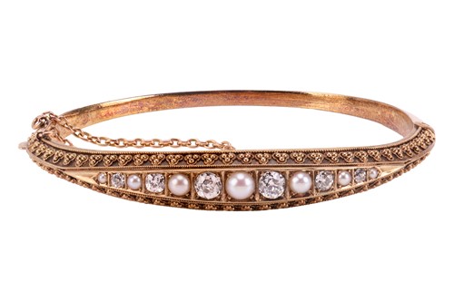 Lot 6 - A Victorian diamond and pearl-set hinged...