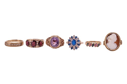Lot 57 - A group of six gem-set rings; The first an...
