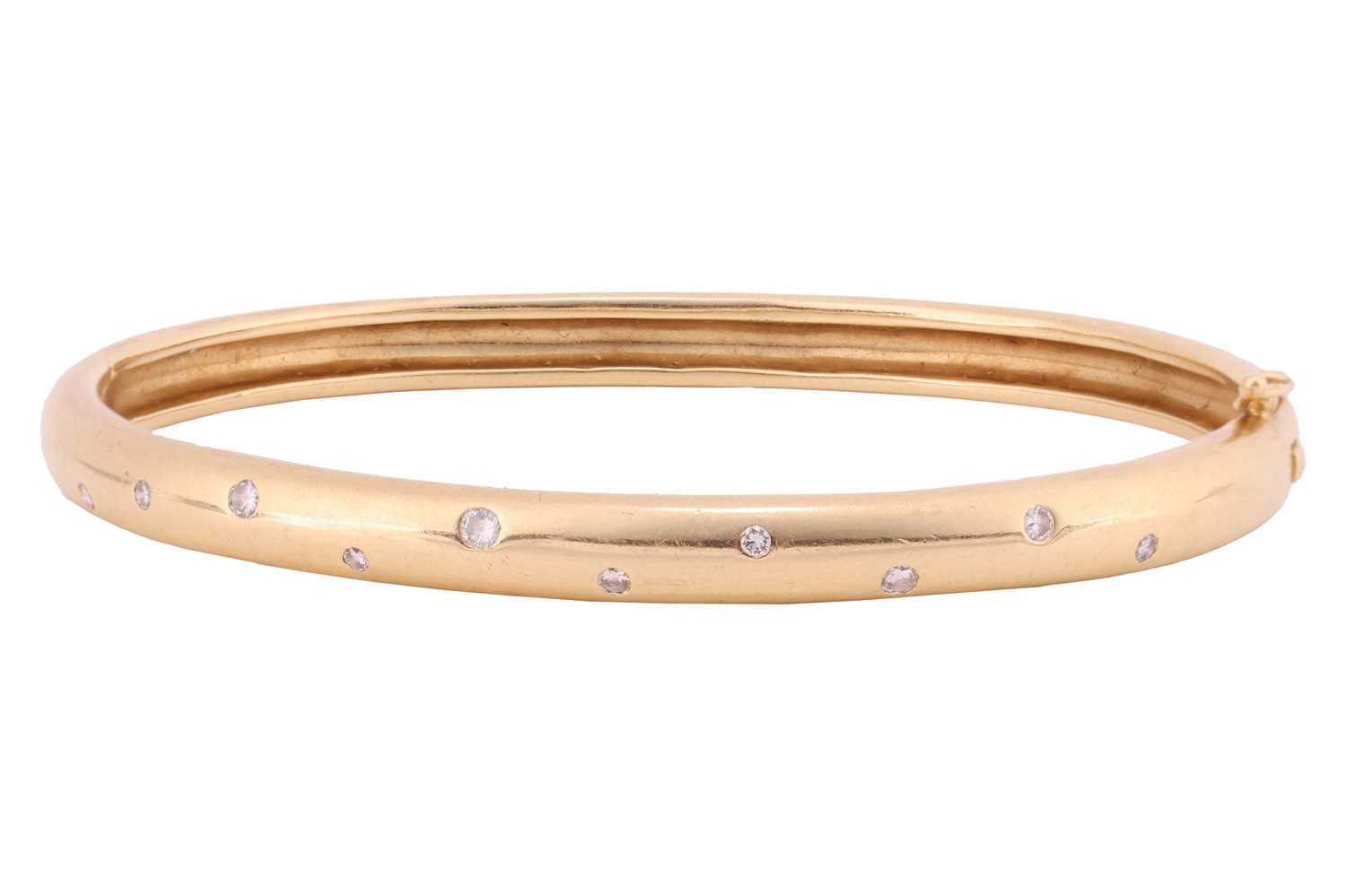 Lot 122 - A diamond-set hinged bangle, the front...