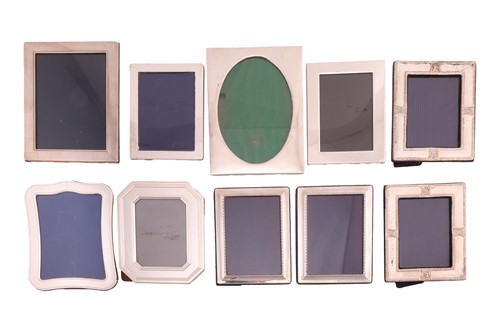 Lot 244 - An agglomeration of silver-framed easel...