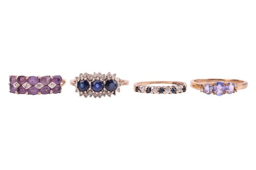 Lot 29 - Four 9ct gold gem-set rings, the first...