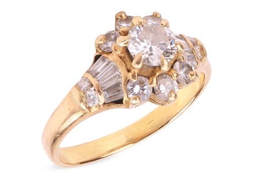 Lot A diamond-set cluster ring, the central round...
